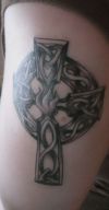 cross tattoo on knee